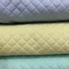 20e99f880c5ed208b3a845c4fc0cbbcc.webp Pre-Quilted Batting Fabric – Quilted Lining Material
