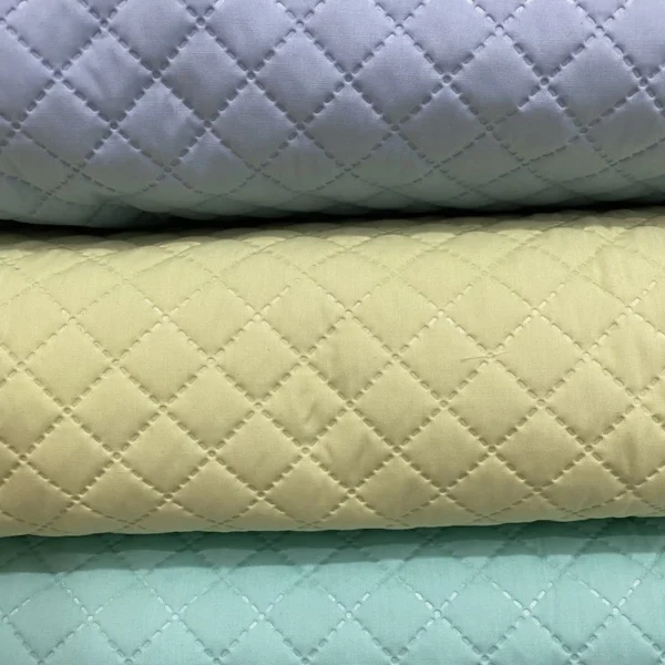 20e99f880c5ed208b3a845c4fc0cbbcc.webp Pre-Quilted Batting Fabric – Quilted Lining Material