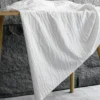 S3a50444f963a4082a90479c8eba5bec5o.webp White Striped Jacquard Knit Fabric – 1 m